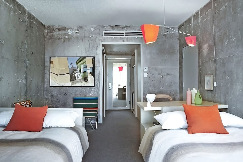Settle in comfortably with two airy beds and bold design