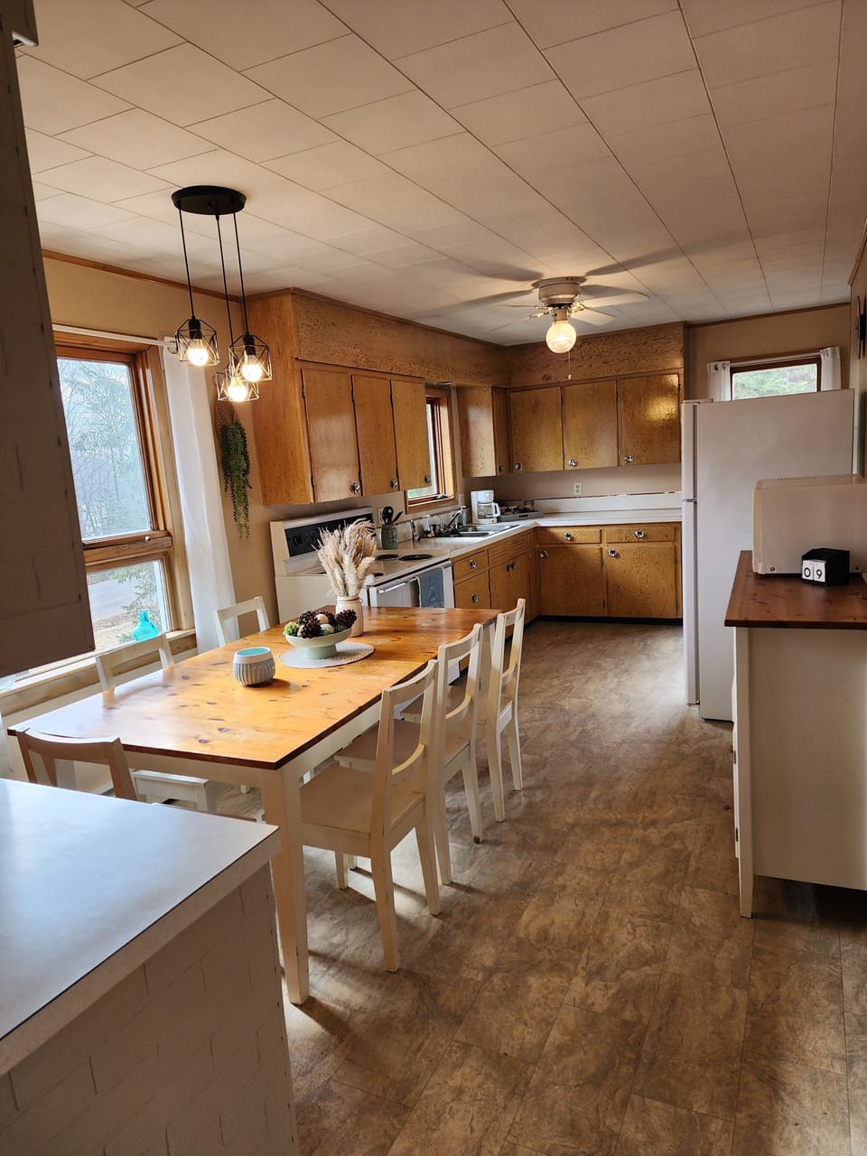 Kitchen & dining with basic amenities provided. 