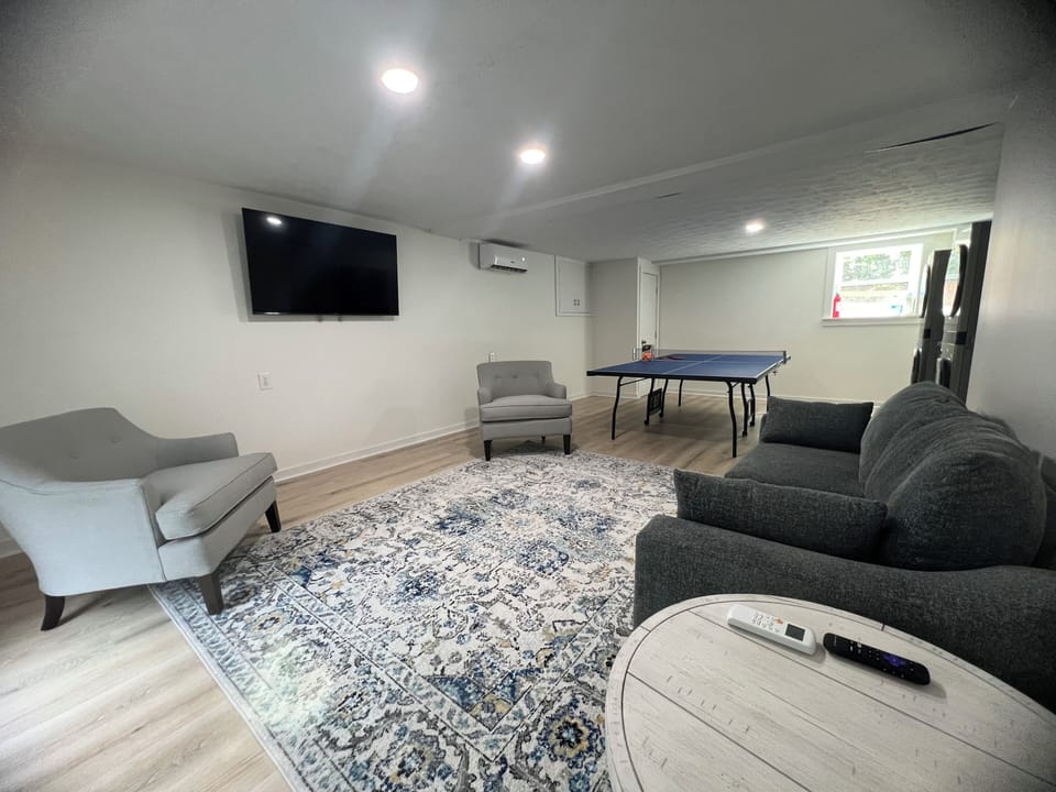 Downstairs game room w/ queen sofa bed. Ping pong table. Two washer/dryer sets. 