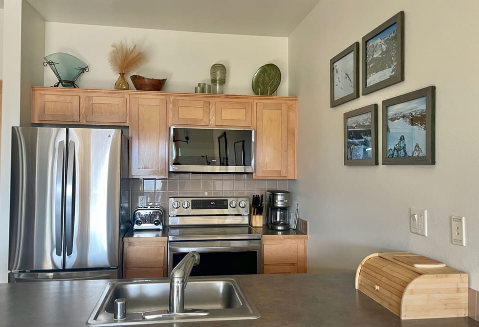 Kitchen with coffee maker, well stocked for your home-cooked meals.