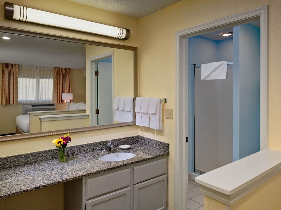 Refresh easily with a roomy vanity and bright, clean shower.