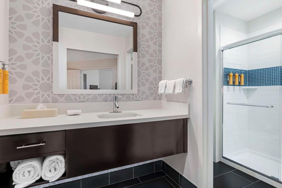 Rinse off in the bright shower with fresh towels ready.
