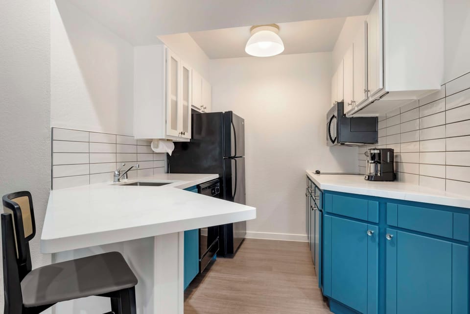 Cook easy meals in the sleek kitchen with full appliances.