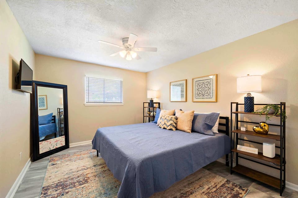 Bedroom Oasis: Enjoy restful nights in a stylish room with modern decor and ample natural light!