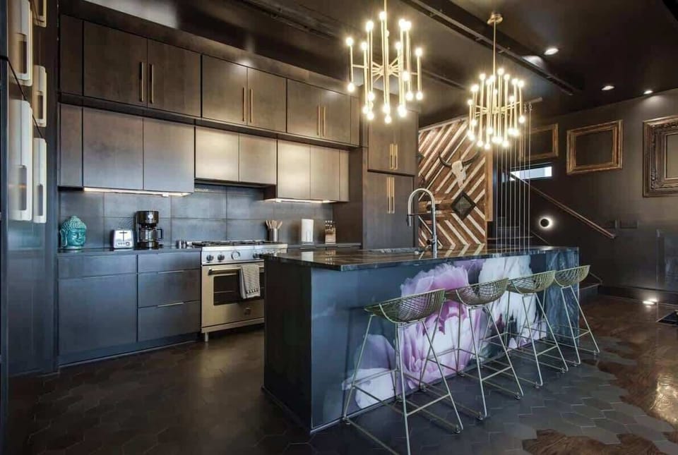 Delight in our kitchen's endless cabinets and soaring high ceilings, combining practical storage with breathtaking openness.