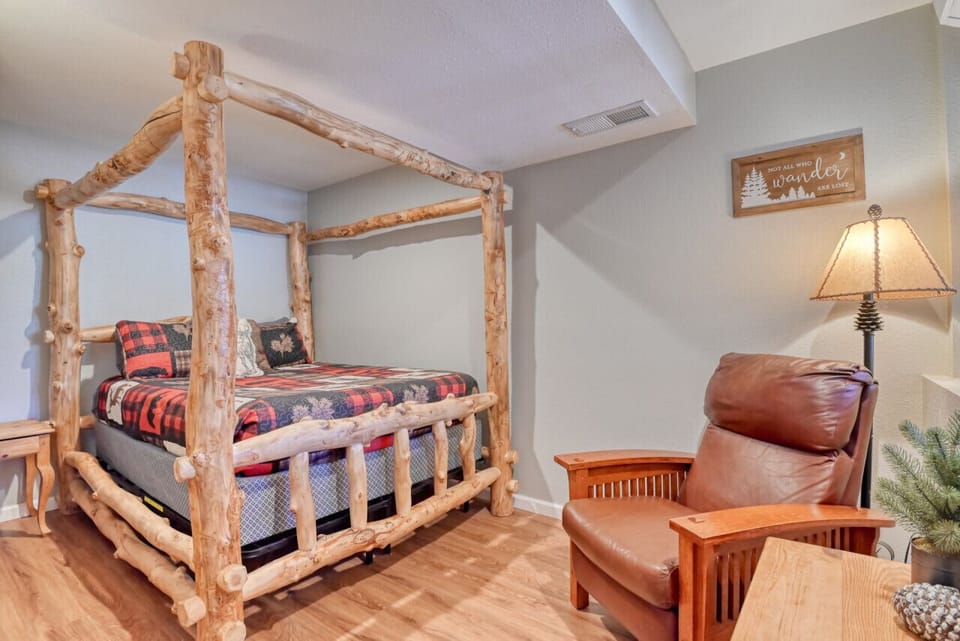 Bedroom has a Queen bed and reading area