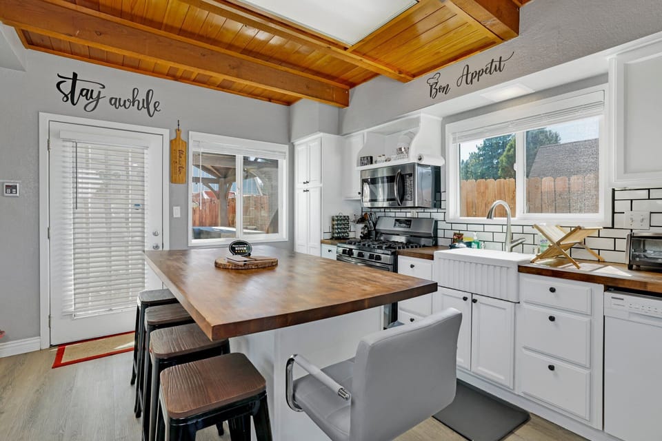Fully equipped cabin kitchen with ample cabinetry, stove, fridge, and coffee maker—perfect for cooking meals, morning coffee, and feeling right at home on your stay.