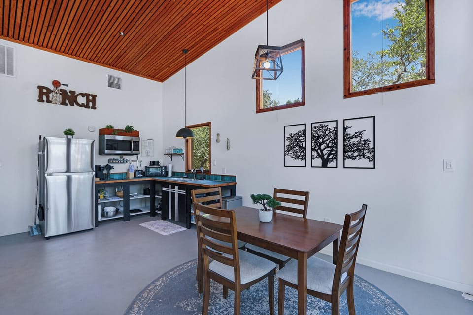 View from the entry door looking right inside the casita. The dining area and kitchen are along these walls.