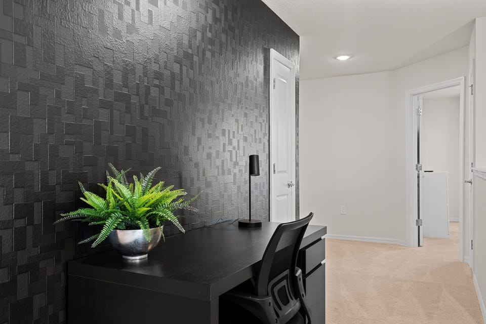 Relax & work in style - Corridor leading to upstairs bedrooms with workspace.