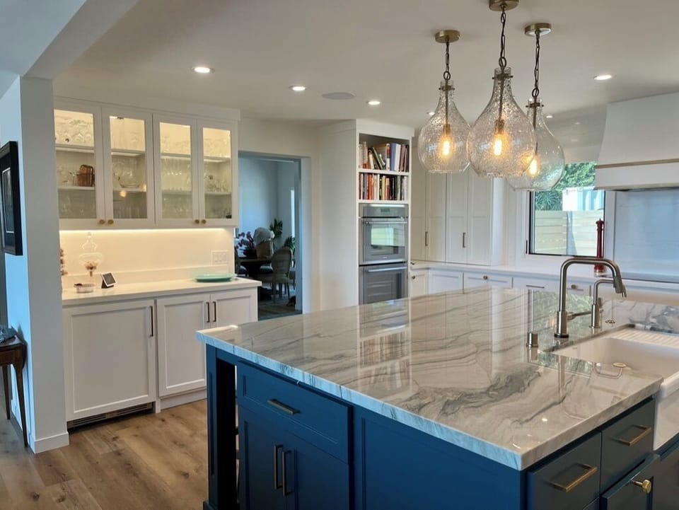 Open kitchen layout with large  farmhouse sink