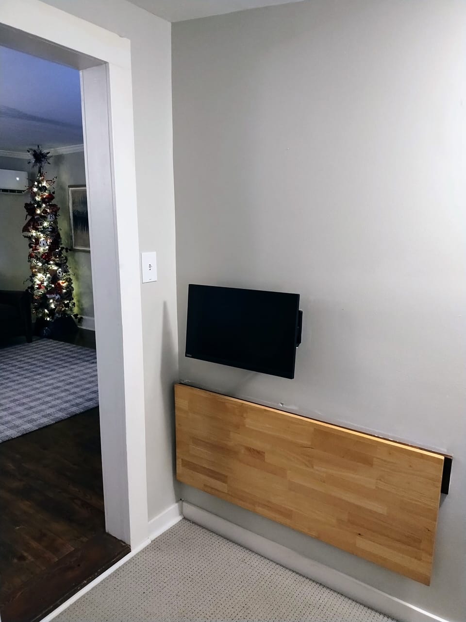 Desk and monitor go flush to the wall once collapsed--easy to walk past it!