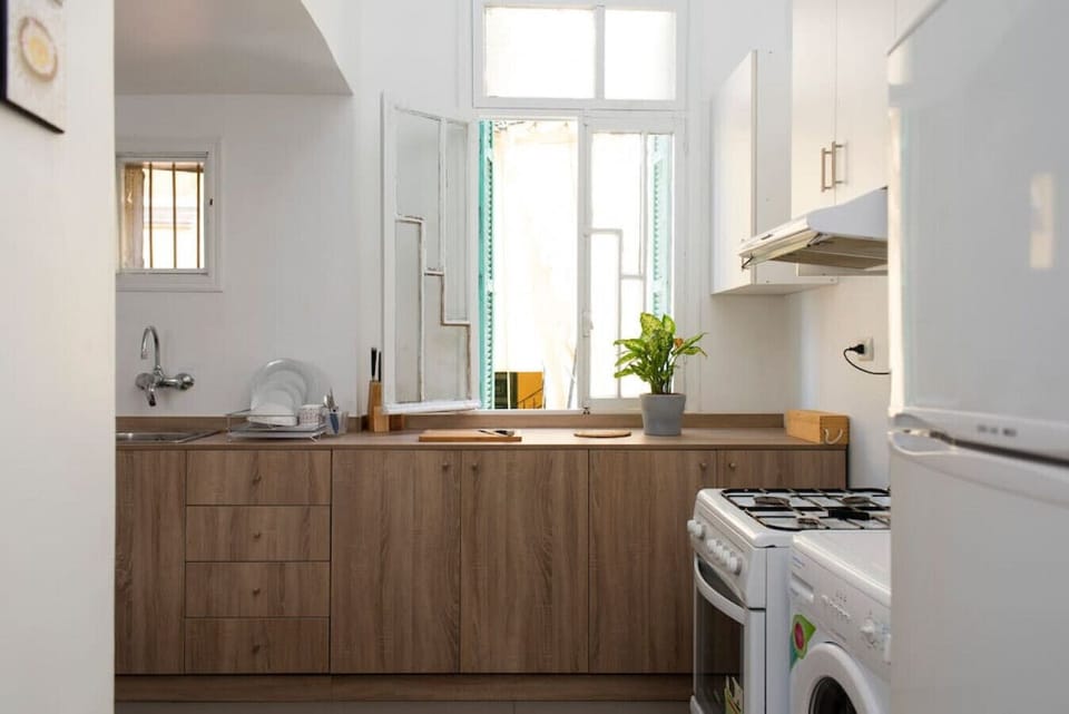 The kitchen is fully equipped with all necessary kitchen utensils and appliances, including washing machine.