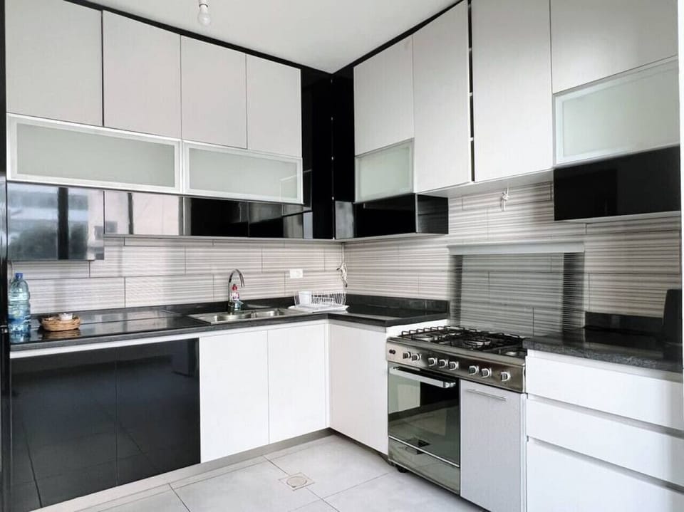 Detailed view of the clean and modern kitchen preparation area.