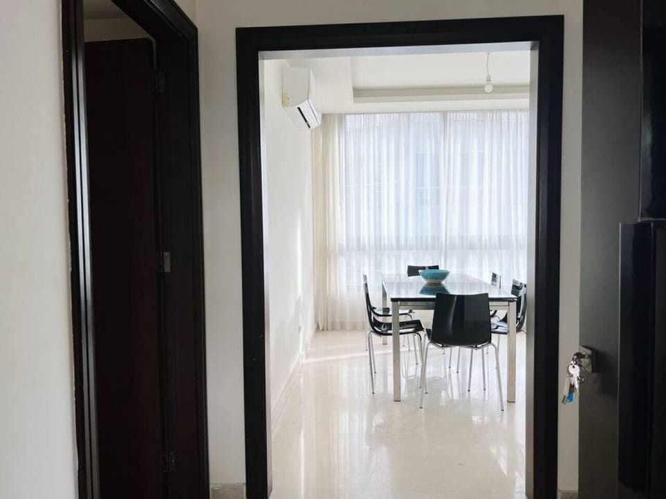 Charming sightlines leading from the hallway into the sunlit interior spaces.