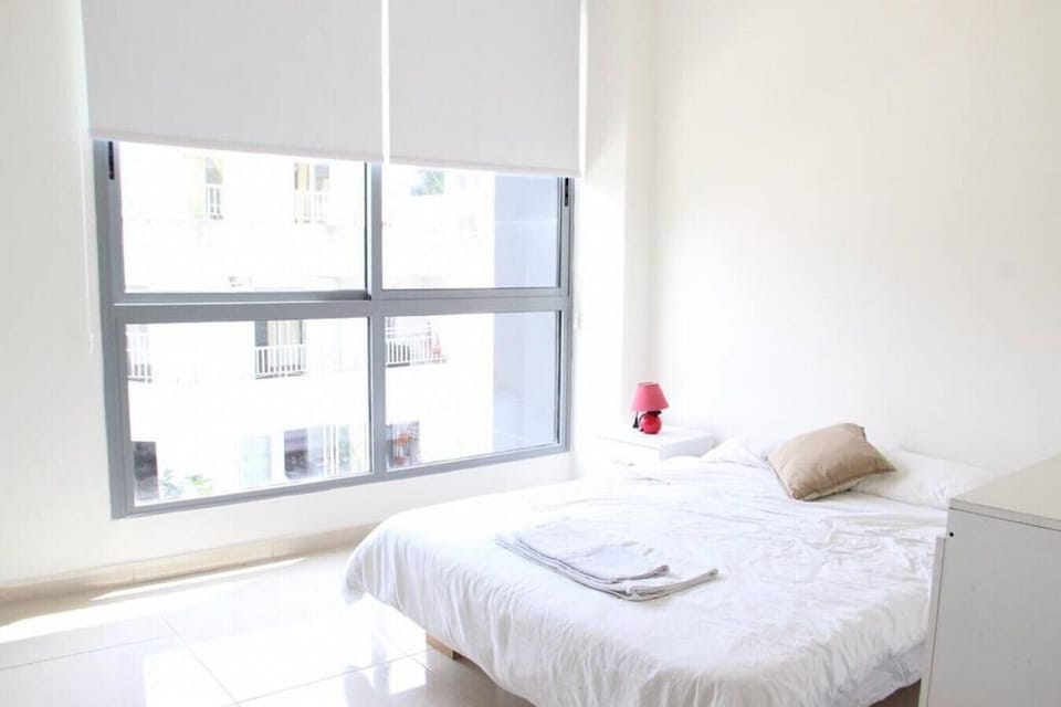 Peaceful sleeping quarters designed with cozy decor and plenty of natural light.