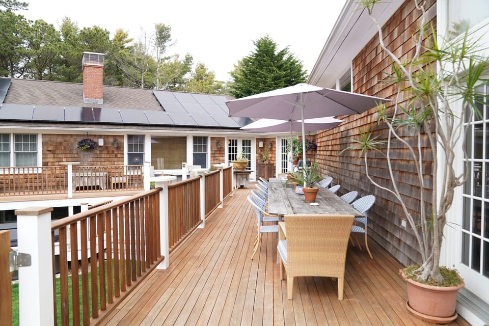 Oversized outdoor deck and entertaining area.  Dining table seats 12+