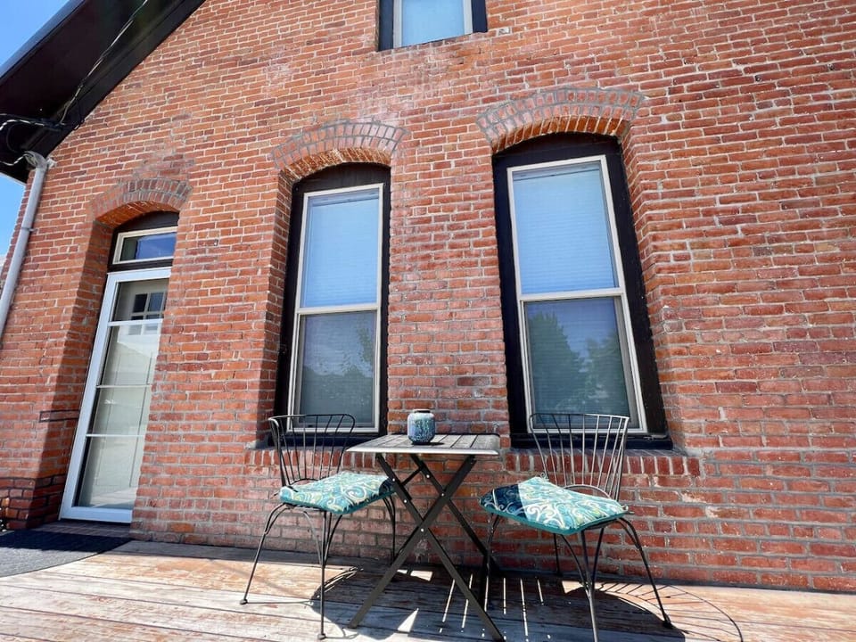 Deck off the living room with outdoor seating for two