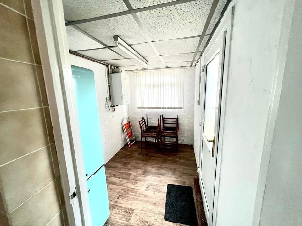 Boot room/utility room with fridge freezer
