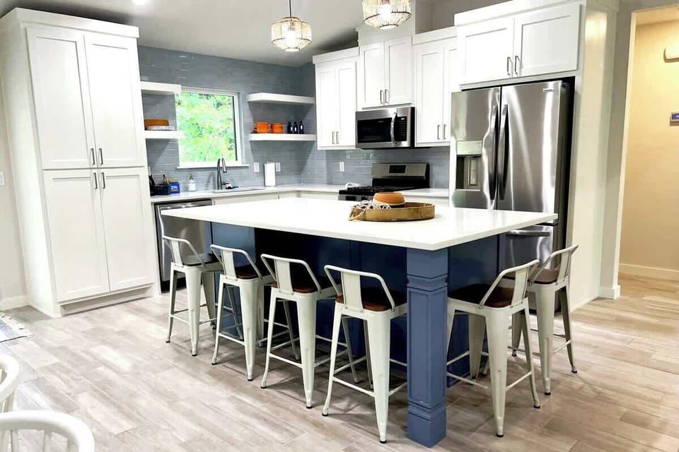 Six barstools are provided for additional seating. 