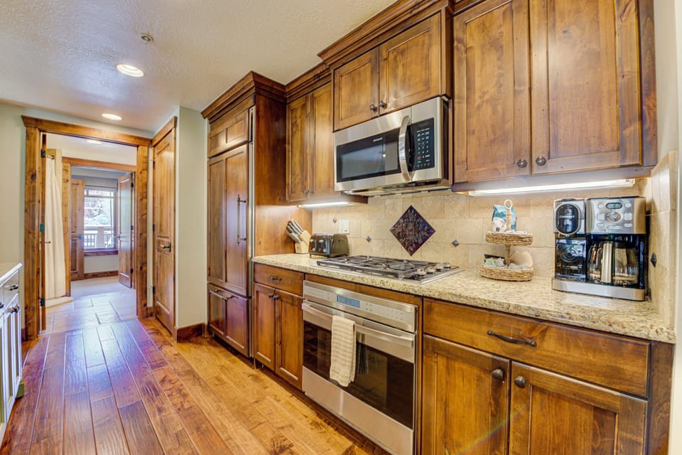 Full kitchen, hand scraped hardwood flooring, custom cabinetry, granite, Wolf stove and oven, Subzero refrigerator...