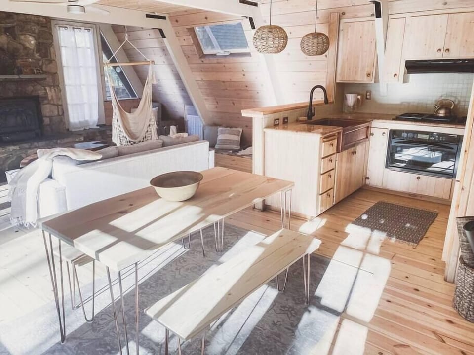 Handcrafted dining table provides an open feel and easy access to both kitchen and living areas. 