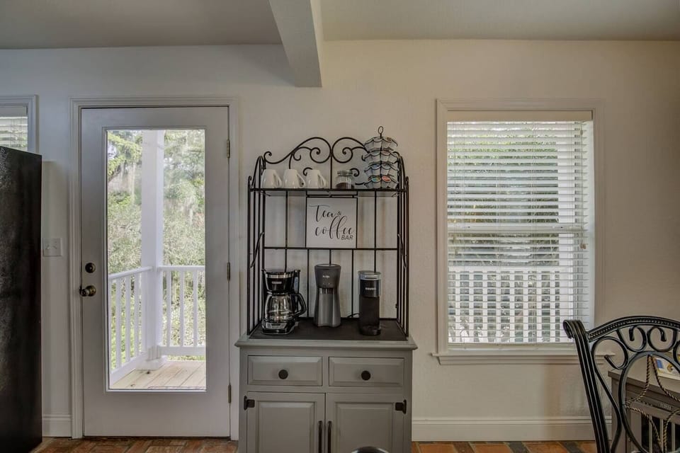 Start every morning here — your dedicated coffee and tea bar, then step straight outside to the river view.
