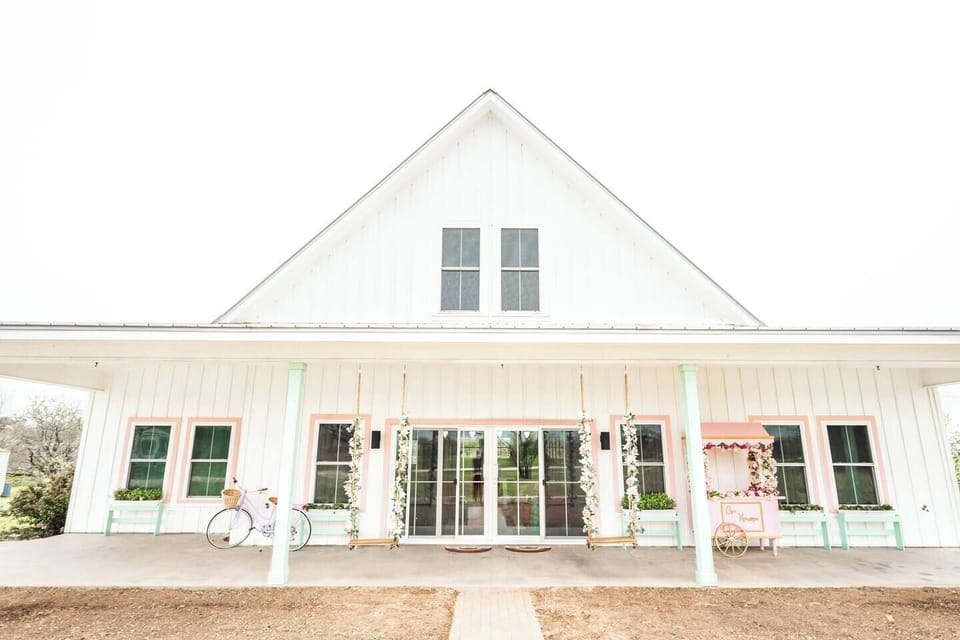 Front view of house with large front patio, sliding doors, and 25' front windows