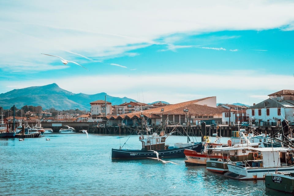 Saint-Jean-de-Luz's famous sheltered bay beach, one of the finest on the Basque coast, basks under a brilliant summer sky.
