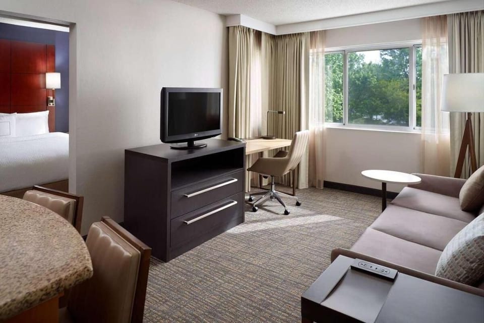 Stretch out in the spacious lounge with desk and big TV.