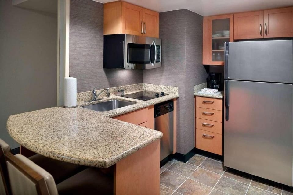 Cook easy meals in the sleek kitchenette with stainless appliances.