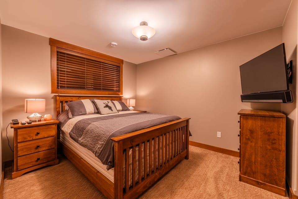 Bedroom 3 - Queen bed on the Main Floor with shared full bathroom.