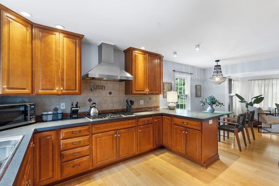 This modern dining area is adjacent to the kitchen so you can enjoy your meal right away.