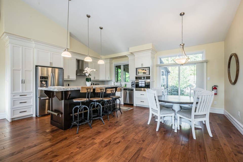 Cook up vacation meals in this fully equipped kitchen with breakfast bar and cozy dining nook.