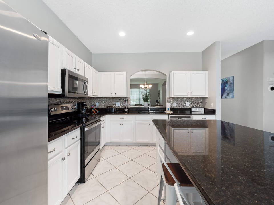 Spacious Full Size Modern Kitchen with Bar Stool Seating