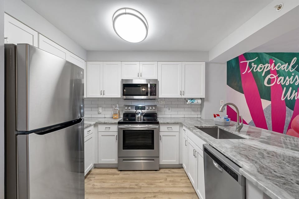 All brand new kitchen with updated appliances, granite counter space and full size refrigerator. Fully stocked with bakeware, cookware, dinnerware, etc. for your convenient use.