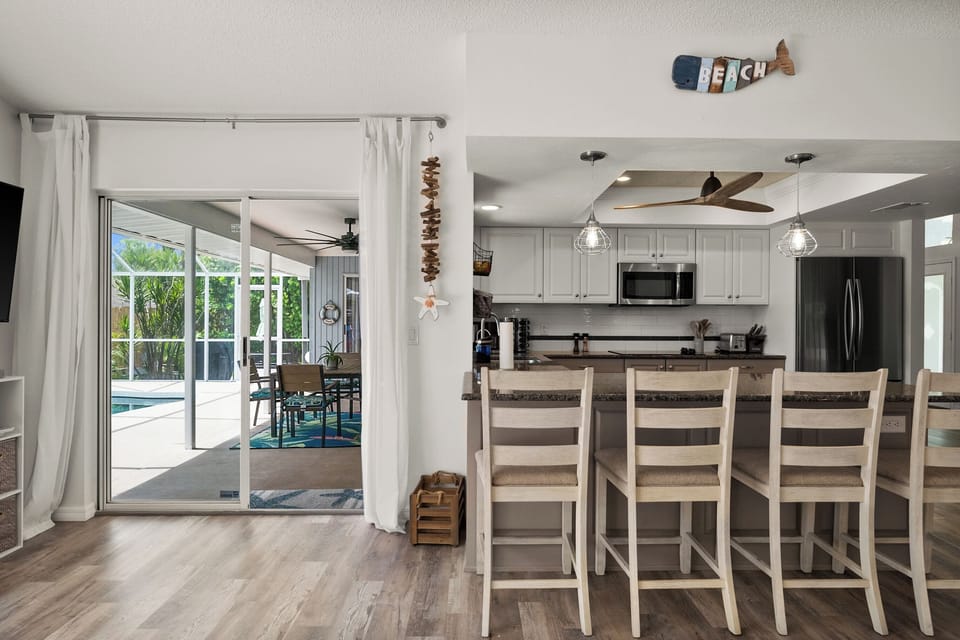 galley kitchen fully stocked with pool views .4 bar stools 