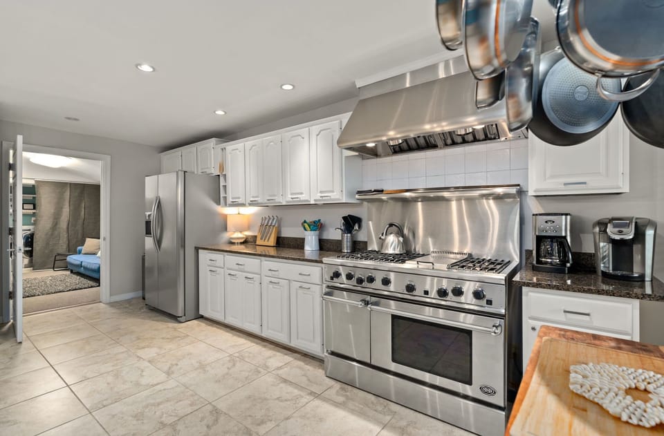 This spacious kitchen features a gas stove and cooking basics! 
