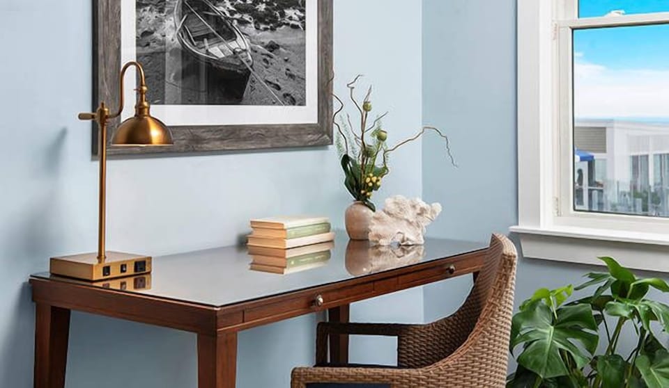 Catch up on emails at a charming desk by the window.