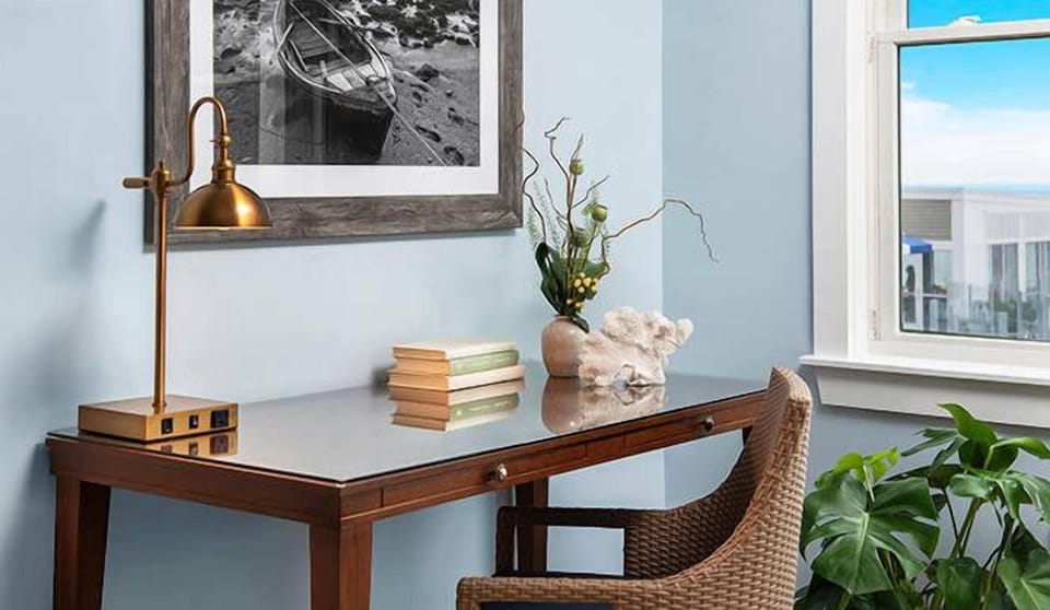Catch up on emails at a charming desk by the window.