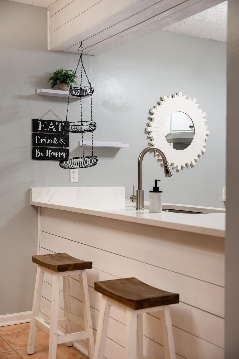 There is more seating at the counter along with shelves to store groceries. 