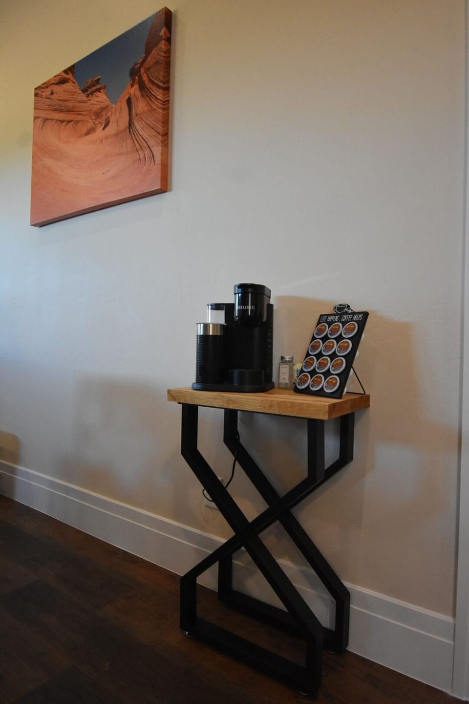 Coffee bar with Keurig coffee maker and a selection of k-cup blends.