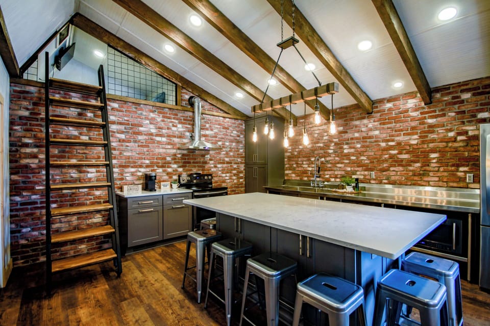 Full kitchen, stainless steel commercial countertop. Big island that seats 8.