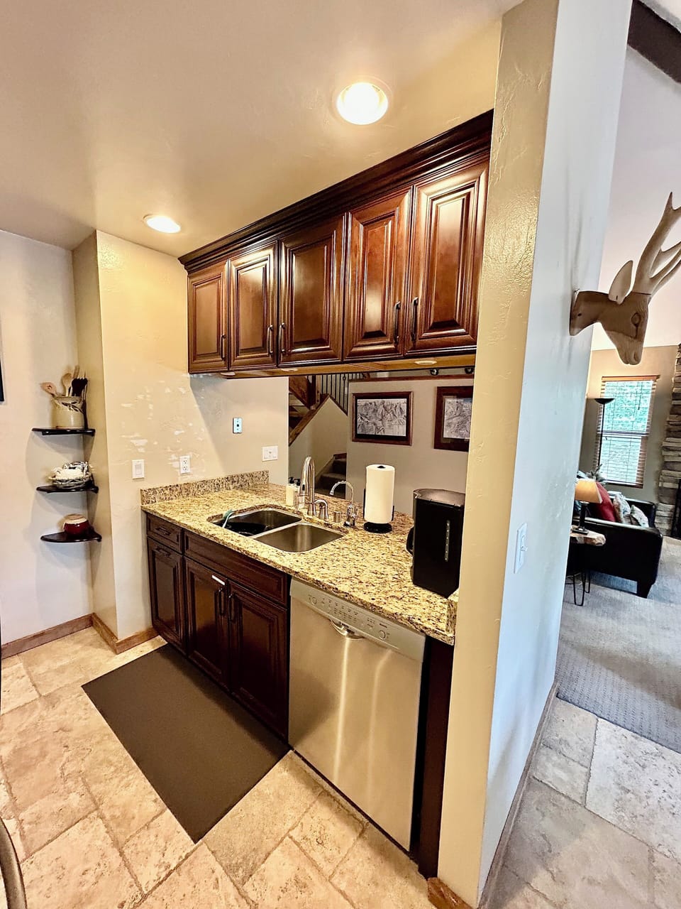 Kitchen pass thru and stainless steel dishwasher.