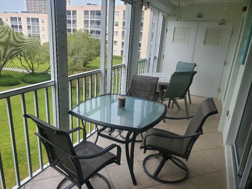 Newer lanai furniture with swivel rocker chairs...plus a 2nd table and 2 chairs.