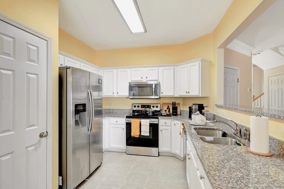 Stainless Steel Appliances: Double-Door Fridge, Oven, Microwave, and Dishwasher