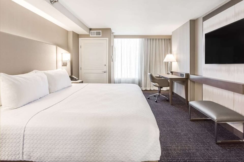 Unwind after adventures with a cozy bed and widescreen TV.
