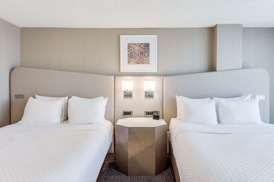 Rest easy with two crisp beds and calming, modern design.