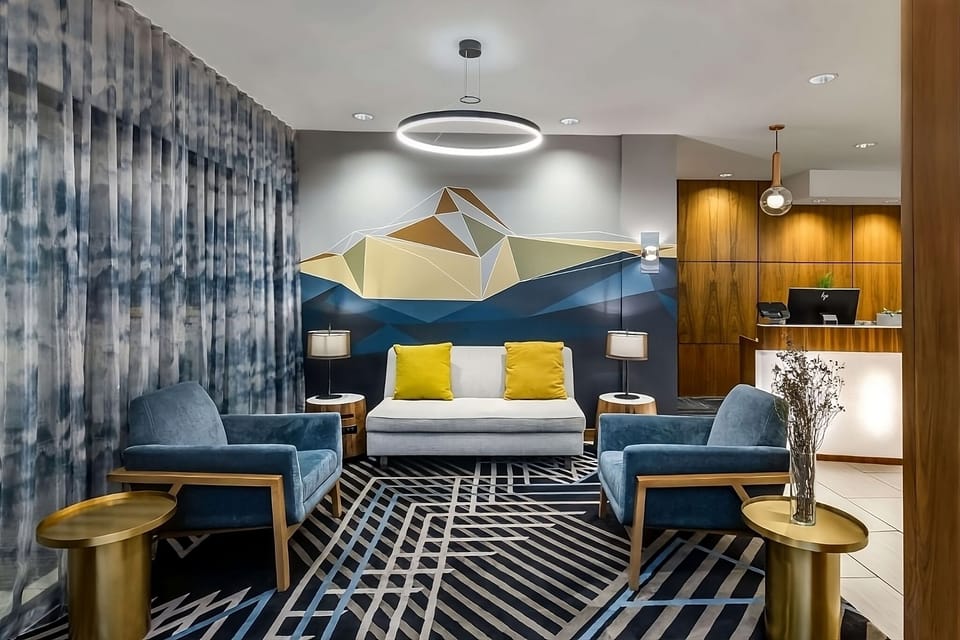 Step into a modern lobby with artful, relaxing seating.