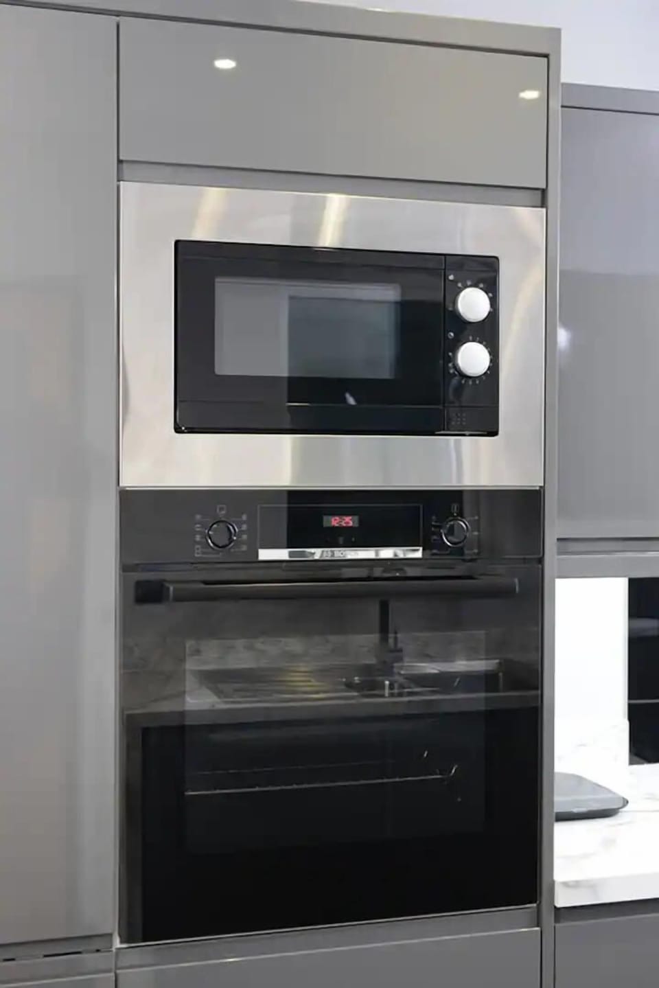 Equipped with oven and microwave for your convenience, ensuring easy meal preparation during your stay.