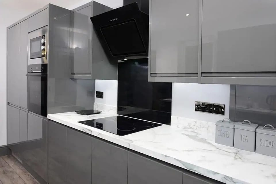 Essential appliances with white marble countertop to added touch of sophistication. 